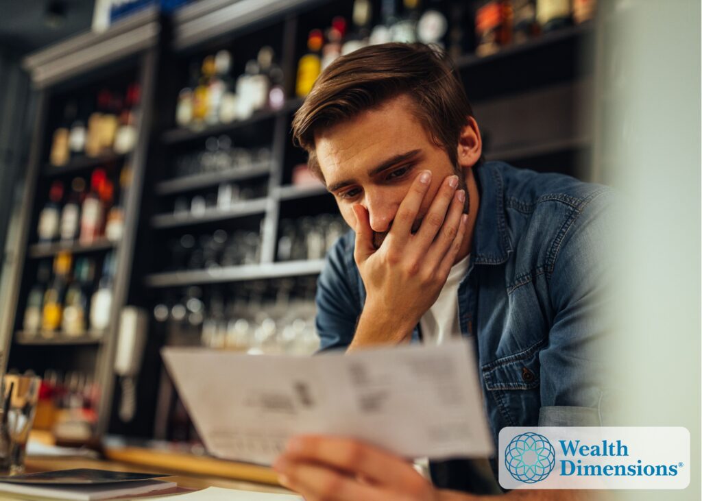 A business owner reviewing a buyout offer at a desk, representing the choice between selling to private equity and an internal succession plan.